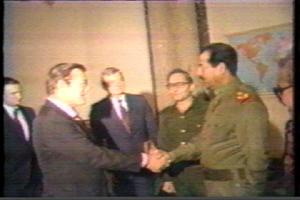 Iraqi President Saddam Hussein greets Donald Rumsfeld, special envoy of Reagan