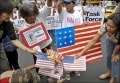 Anti-US demonstrators burn copies of the US flag near the US embassy in Manila