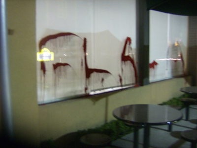 RED PAINT SPLASHED ON MULTINATIONAL KILLERS (Mexico)