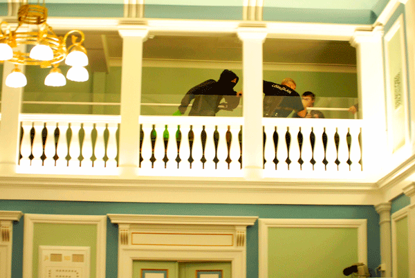 One of the accused and a policemand on the parliament balcony