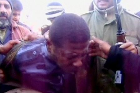 A man believed to be a mercenary from Chad, captured by anti-government demonstr